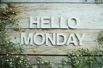 Hello Monday alphabet letters on wooden background