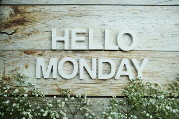 Hello Monday alphabet letters on wooden background