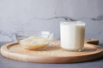glass of milk and rice on a table, non dairy milk concept 