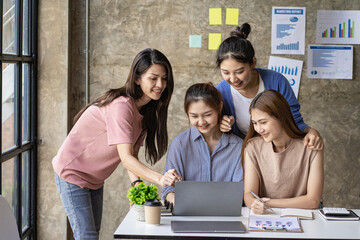a group of successful business people in the conference room Asia Youth Team Startup Ideas: Meet young entrepreneurs brainstorm business plans and share ideas in a workshop.