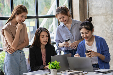 a group of successful business people in the conference room Asia Youth Team Startup Ideas: Meet young entrepreneurs brainstorm business plans and share ideas in a workshop.