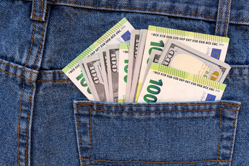 A bundle of money in a trouser pocket. Close-up.