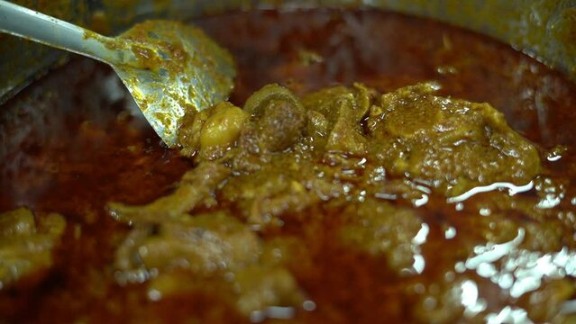 Close up shot of mutton kosha garnish with spices