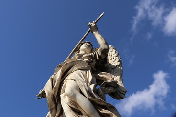 Ponte Sant'Angelo Bridge Statue of an Angel Holding a Spear Close Up in Rome, Italy