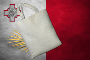 Patriotic tote bag mock up on background in colors of national flag. Malta