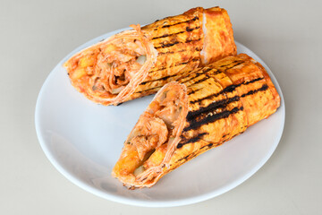 Lavash doner kebab ( doner zurna durum )  or shawarma sliced in plate isolated. 
