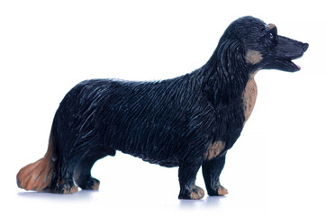 Figurine small dog on white background isolation