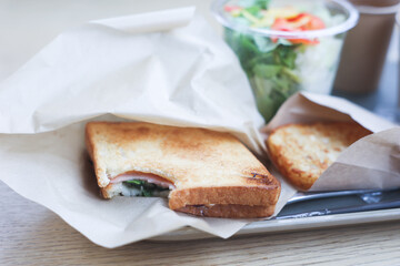 Morning sandwiches with drink and salad.
