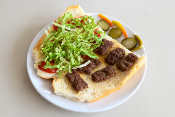 Meatball between bread (Turkish name : ekmek arasi kofte ) Izgara kofte. Manisa, Akcaabat, Akhisar  kofte