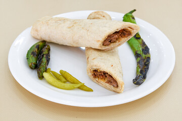 Lavash doner kebab ( doner zurna durum )  or shawarma sliced in plate isolated. 