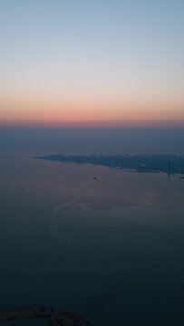 Vertical timelapse of a sunrise sky over the shore of Kuwait