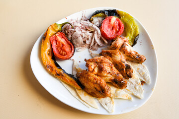 Chicken wings barbeque in a dish with BBQ grill sauce . Izgara tavuk kelebek sis kanat. Tavuk sis, gogus.