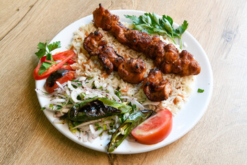 Beef steak grill with rice pilaf, fried potatoes, grilled pepper and tomatoes.Mix Platter with Beef rips, Cutlets, Potatoes and Sauces.
