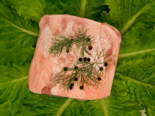 Piece of frozen meat, from which blows frosty freshness and cold.