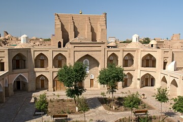 Fototapeta na wymiar Sherghazi Khan madrasa built in the 18th century in Itchan Kala, the historical part of Khiva city. Uzbekistan.