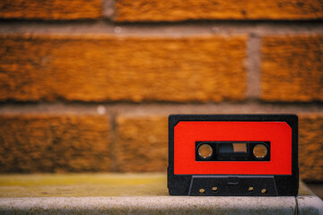 audio cassette tape on brick background