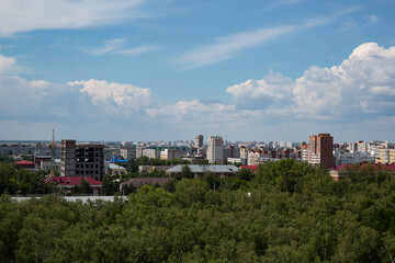 Fototapeta premium View of the buildings from the Ferris wheel in the park named after the 30th anniversary of the Komsomol of Omsk in summer