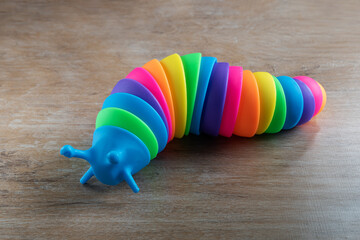 3D articulated fidget toy slug shape - obrazy, fototapety, plakaty
