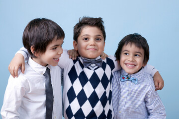 Little Cute Twins and Their Best Friend Are Posing