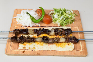 Beef steak grill with rice pilaf, fried potatoes, grilled pepper and tomatoes.Mix Platter with Beef rips, Cutlets, Potatoes and Sauces.