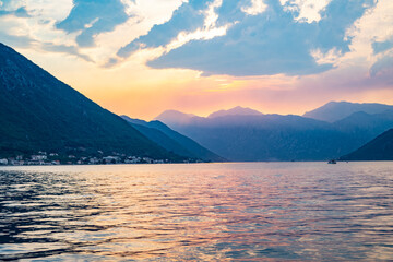 aerial view on bay over the water during sunset with mountains on backgorund