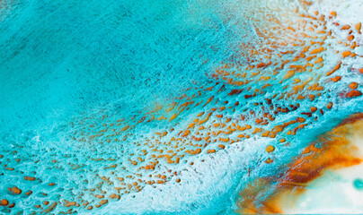 Fototapeta na wymiar Artistic texture painted with liquid acrylic paints. Fluid art for background, wallpapper or poster. Backdrop similar to the landscape of the ocean. Sea artwork with turquoise waves and white foam.
