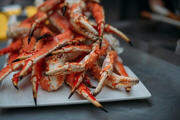 Legs of fresh red Kamchatka crab on the table in the restaurant kitchen. Freshly frozen crab meat for cooking