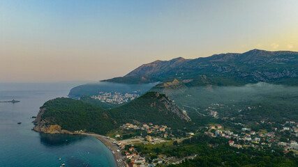 aerial view on Petrovac, Budva with clouds on sunrise