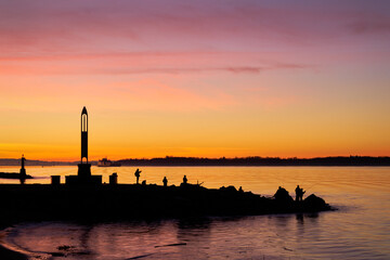 Garry Point Early Morning Fishing Richmond. Anglers out at dawn in Steveston, British Columbia, Canada. 

