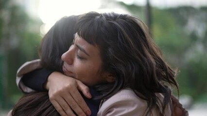 Sympathetic woman hugging friend with EMPATHY and SUPPORT. Friendship concept between two best friends
