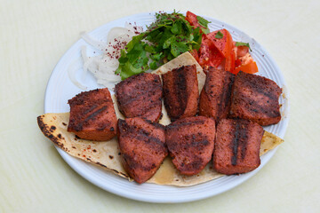 Grilled chili, tomato and sucuk between bread. ( Sucuk ekmek ) 