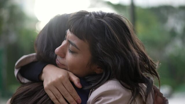 Sympathetic woman hugging friend with EMPATHY and SUPPORT. Friendship concept between two best friends