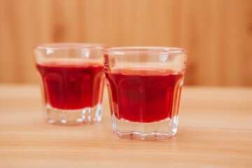 Fresh red drink in two glasses on the table