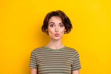 Portrait of young funny lady pouted lips make photo look directly you isolated on bright yellow color background