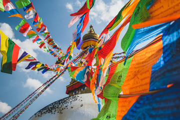 Colorful vibrant Tibetan prayer flags at Boudhanath Temple, Kathmandu, Nepal.