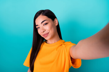 Fototapeta premium Photo of sweet brunette long hairstyle lady do selfie wear yellow t-shirt isolated on teal color background