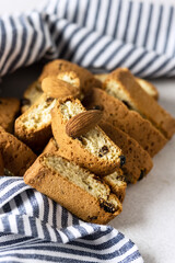 Sliced Freshly Baked Traditional Homemade Italian Sweet Cookies Cantuccini Napkin on Gray Background Vertical