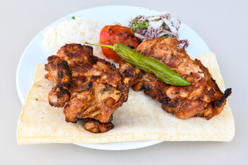Chicken wings barbeque in a dish with BBQ grill sauce . Izgara tavuk kelebek sis kanat. Tavuk sis, gogus.