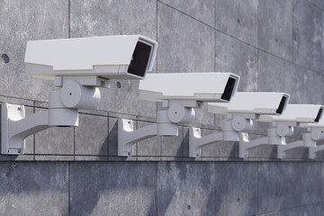 Security cameras on the concrete wall.
Outdoor Security cameras. CCTV, secure, monitoring concept. 3d rendering