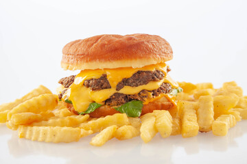 Brioche donut double decker beef cheese burger with queso sauce and rocket leaves.