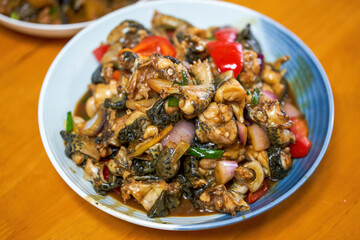 A delicious Chinese dish, fried bullfrog in sauce