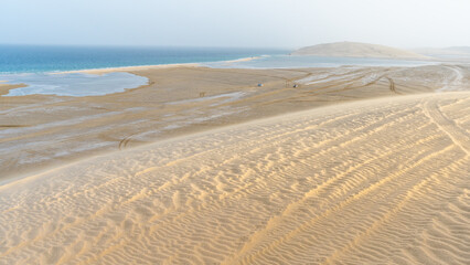 qatar adventurous place khor al udeid ,sea line beach during sunset.