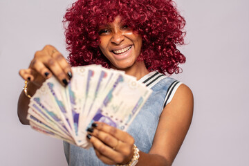 excited and happy african lady flaunting some cash