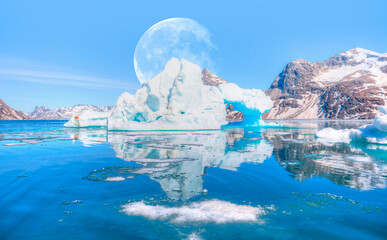 Melting icebergs by the coast of Greenland, on a beautiful summer day with super full moon  "Elements of this image furnished by NASA "