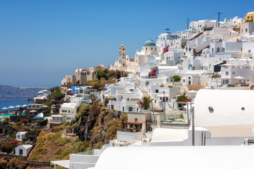 Naklejka premium Beautiful white architecture of Santorini island, summer landscape with blue sky, sea and caldera view, outdoor travel background, Imerovigli, Greece