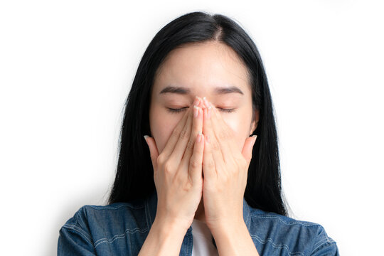 Asia woman having headache and feeling unwell and touching her faces on white background