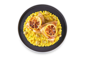Moroccan fried chicken breast with curry rice in a plate on a white isolated background