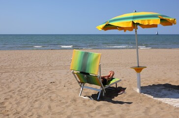 deck chairs to relax under the umbrella on the beach