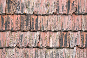 Closeup surface of old weathered ceramic tiles covering building roof