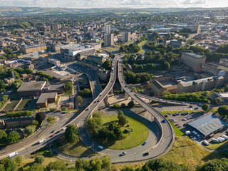 Aerial view of Burdock Way and North Bridge with the Town of Halifax, West Yorkshire, UK in the distance
